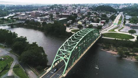 aerial view of easton pa and delaware river with traffic on the bridge and many houses in the distance