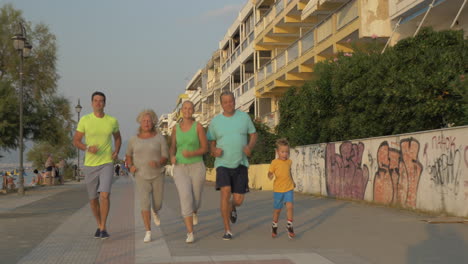 cheerful big family going in for sport together