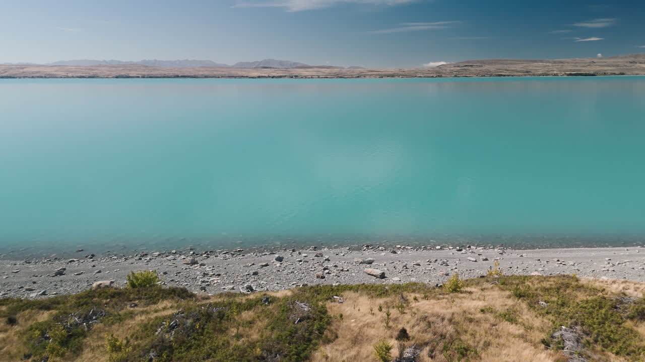 Turquoise Lake with Mountains in the Background