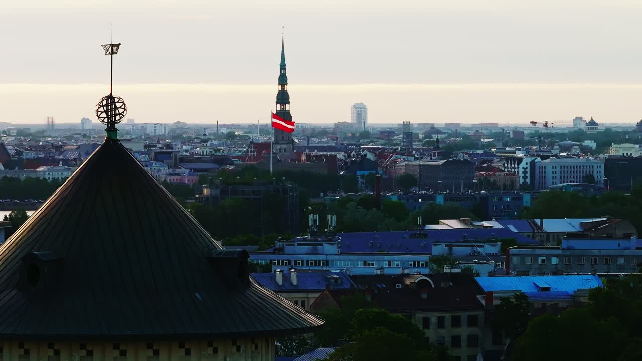 National pride meets architectural heritage in Riga’s historic skyline, daybreak