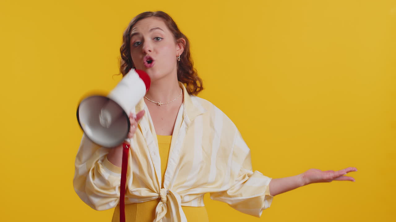 Woman talking with megaphone proclaiming news loudly announcing advertisement pointing empty place