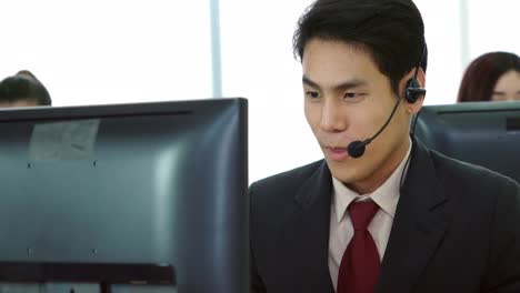 business people wearing headset working in office