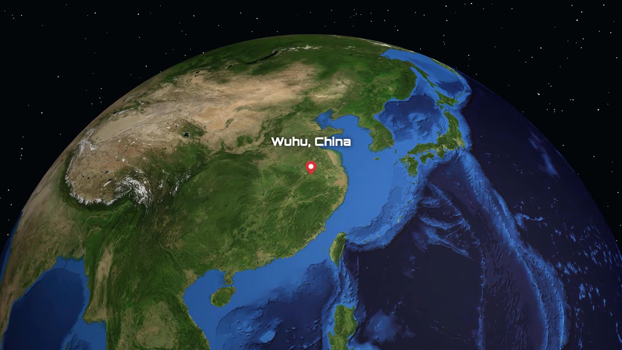 Digital animation zooms from outer space into a specific map marker in Wuhu, China