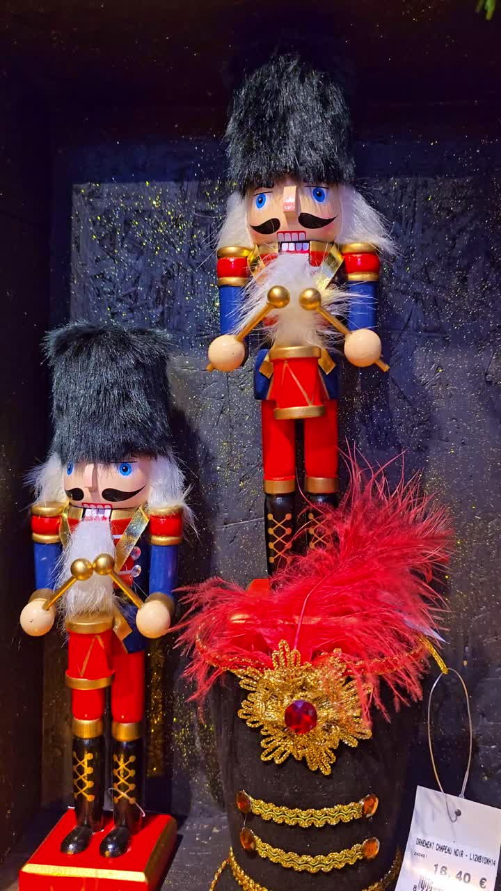 Backward close-up of Christmas nutcracker ornaments displayed under festive lights