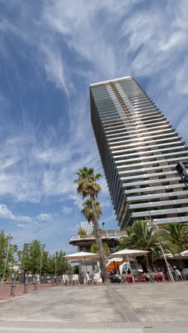 wide angle timelapse of skyscraper buildings in barcelona in vertical