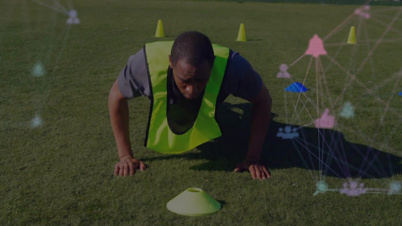 Male athlete in neon vest pushing from push-up into sprint for fitness drill, network overlay right