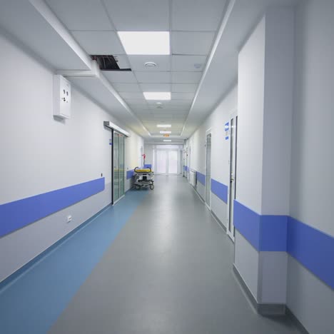 empty corridor in modern hospital. long corridor in hospital with doors and reflections