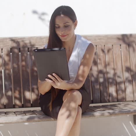 Adorable-Business-Woman-Working-on-Tablet