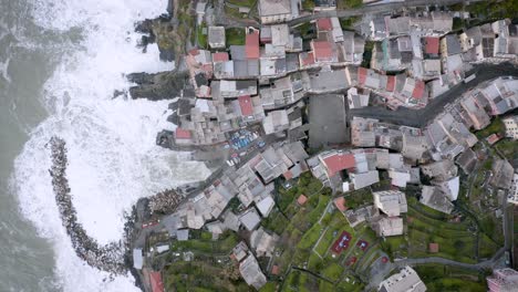 Aerial-view-of-Riomaggiore,-Cinque-Terre,-during-a-sea-storm