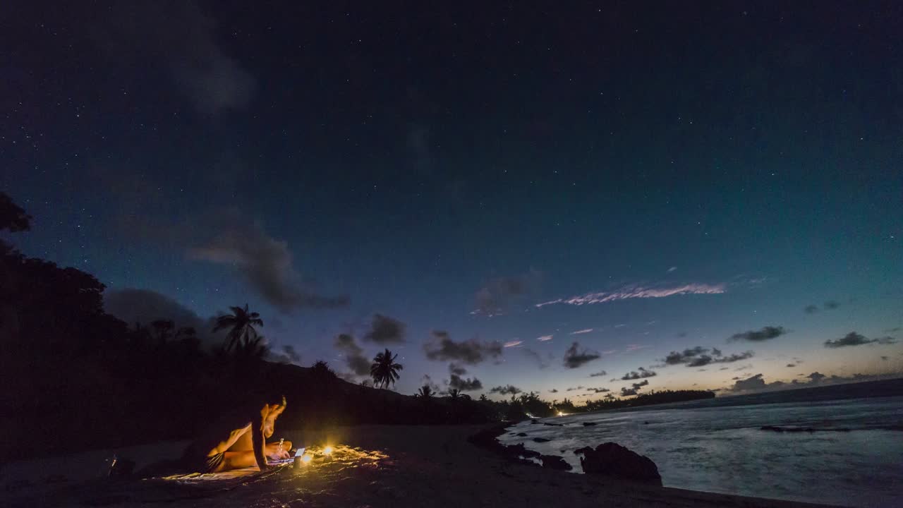 Timelapse of people on beach watching sunset. Slider movement