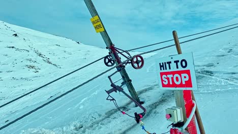 emergency stop button on the ski slope at hanmer ski area to stop the nutcracker cable lift