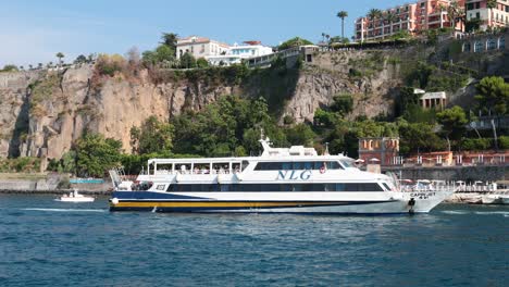 a ship cruises along the scenic sorrento coastline