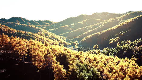 colorful mountains range in autumn season with red orange and golden foliage