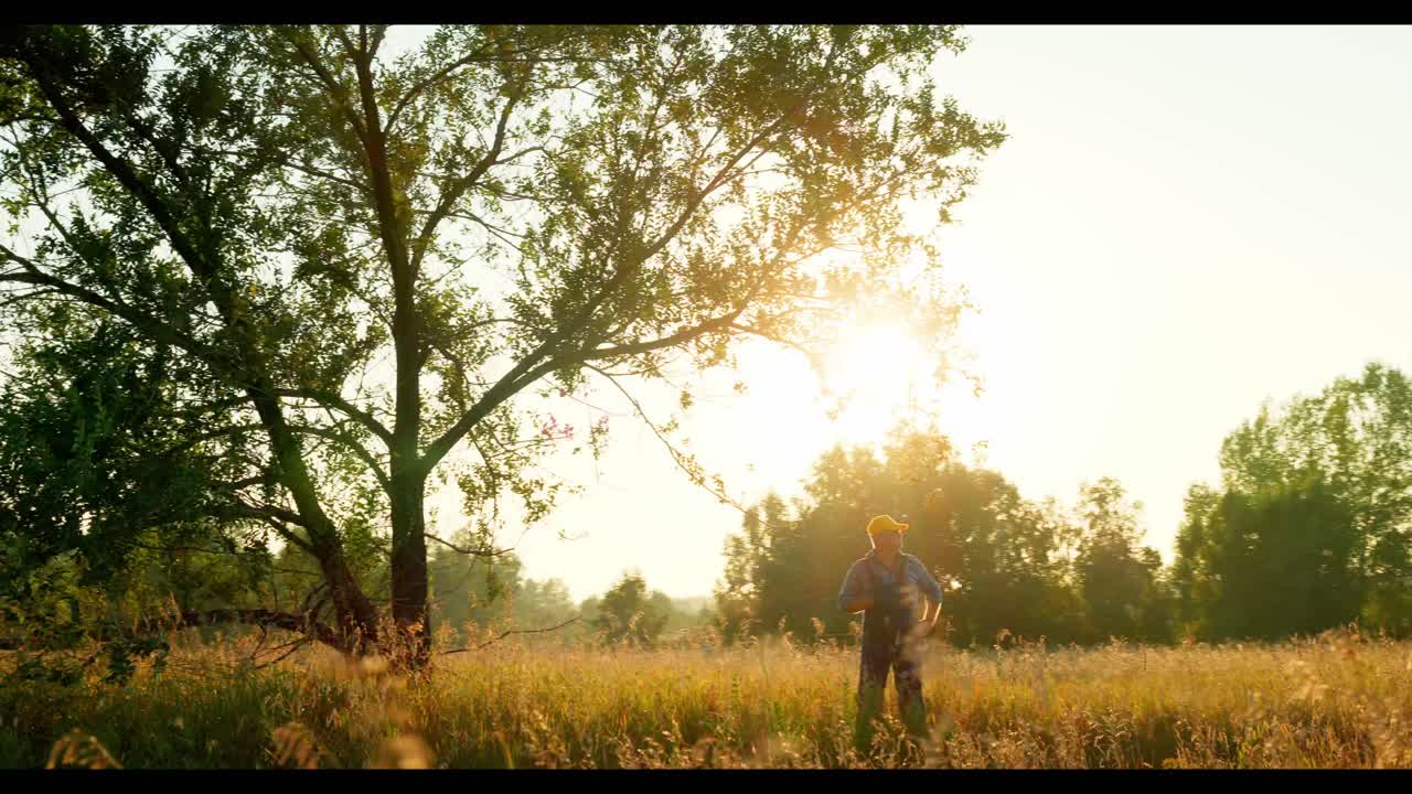 Farmer in a Field at Sunset