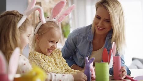 handheld video of mother and daughters playing with easter toys