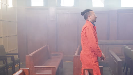 african american inmate walking into court room