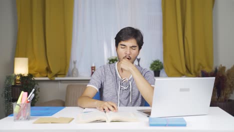 Male-student-falls-asleep-while-studying.