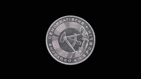 east germany 1968 1 pfennig coin obverse with national emblem rotating on black background