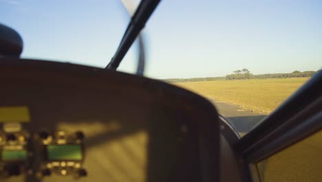 cockpit view in a plane going down the runway about to depart and take off from the hot destination airport