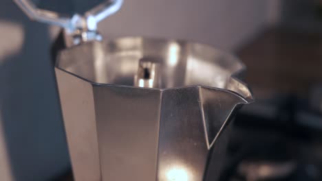 close-up of moka pot brewing morning coffee