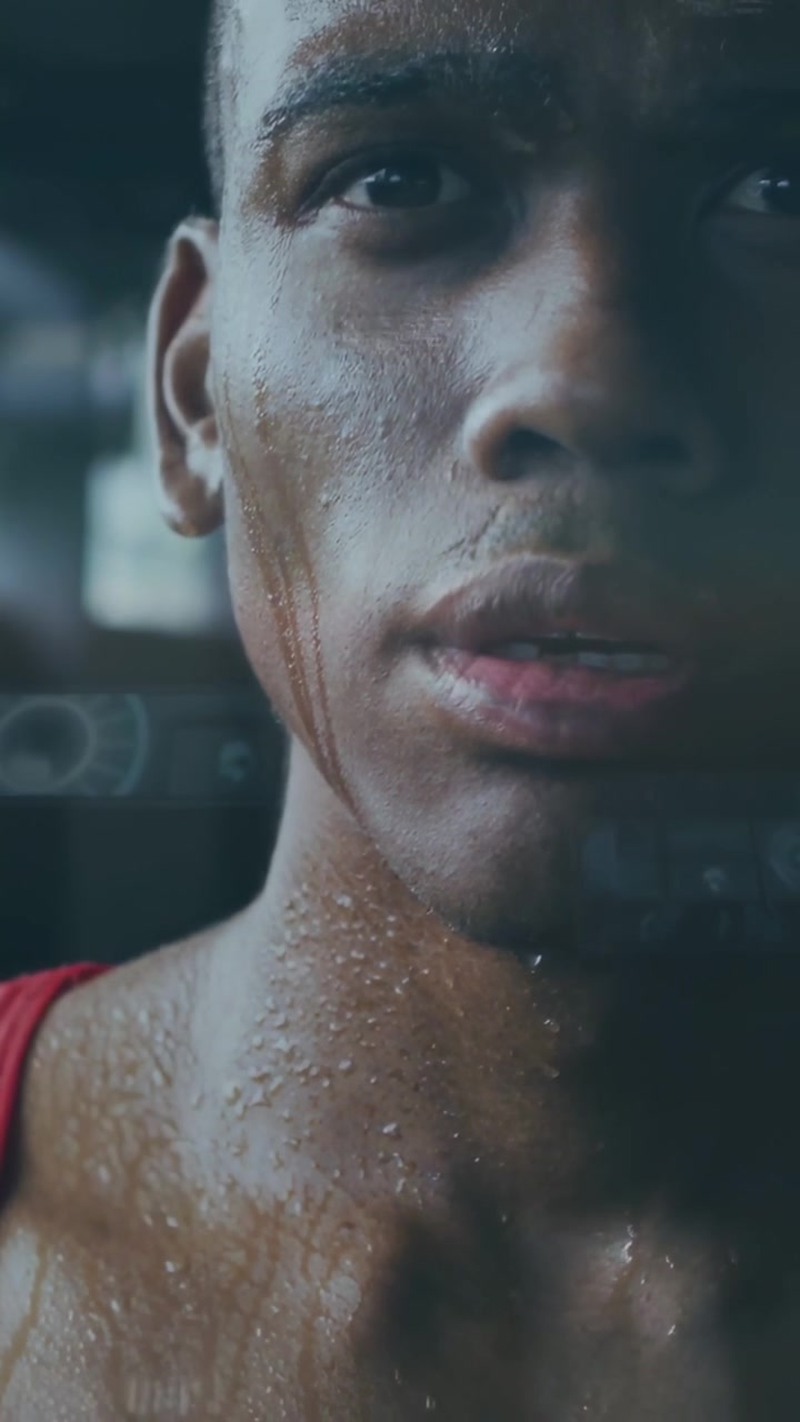 Camera rising, athlete breathing and steadying after hard workout at gym, red tank and sweat streak