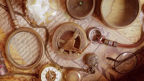 vintage style travel and adventure. vintage old compass and other vintage items on the table.