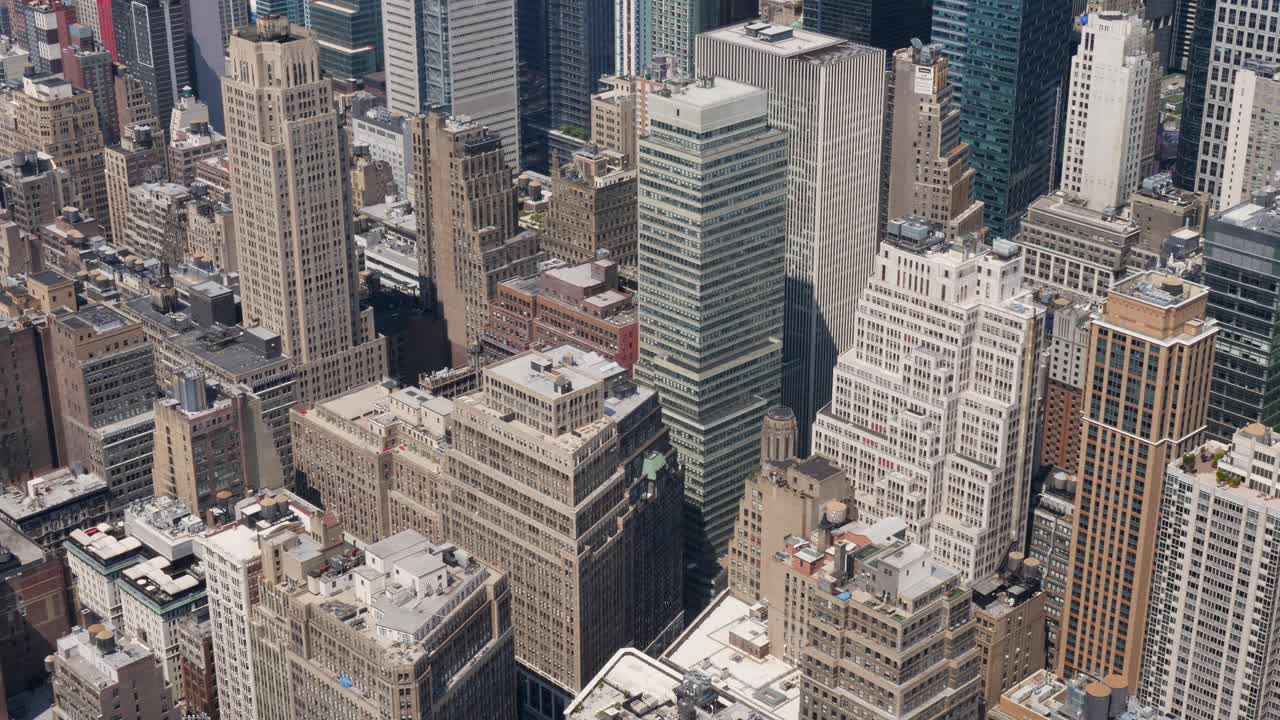 Slow motion landscape of city skyscrapers towers buildings urban CBD skyline of Manhattan New York USA America architecture infrastructure design commercial Empire State