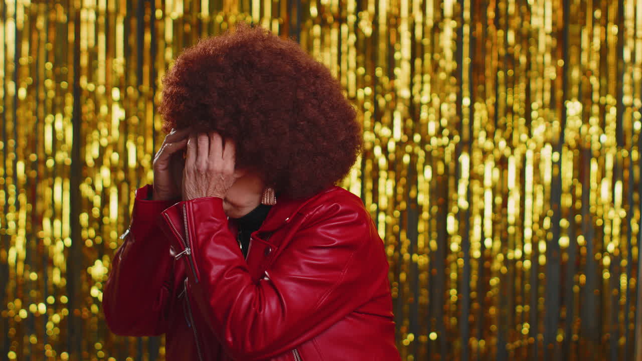 Nosy curious woman closing eyes with hand and spying through fingers, hiding and peeping, exploring