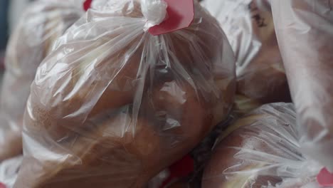 individually packaged bread loaves in plastic bags