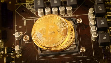 gold bit coin btc coins on the motherboard. bitcoin is a worldwide cryptocurrency and digital payment system called the first decentralized digital currency.