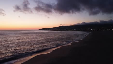 drone shot at the beach during sunset
