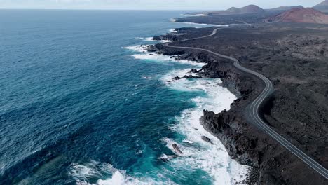 dramatic aerial drone footage of los hervideros in lanzarote, canary islands, spain.