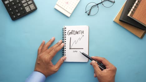 growth chart on notebook - business planning