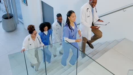 team of doctors walking up the stairs