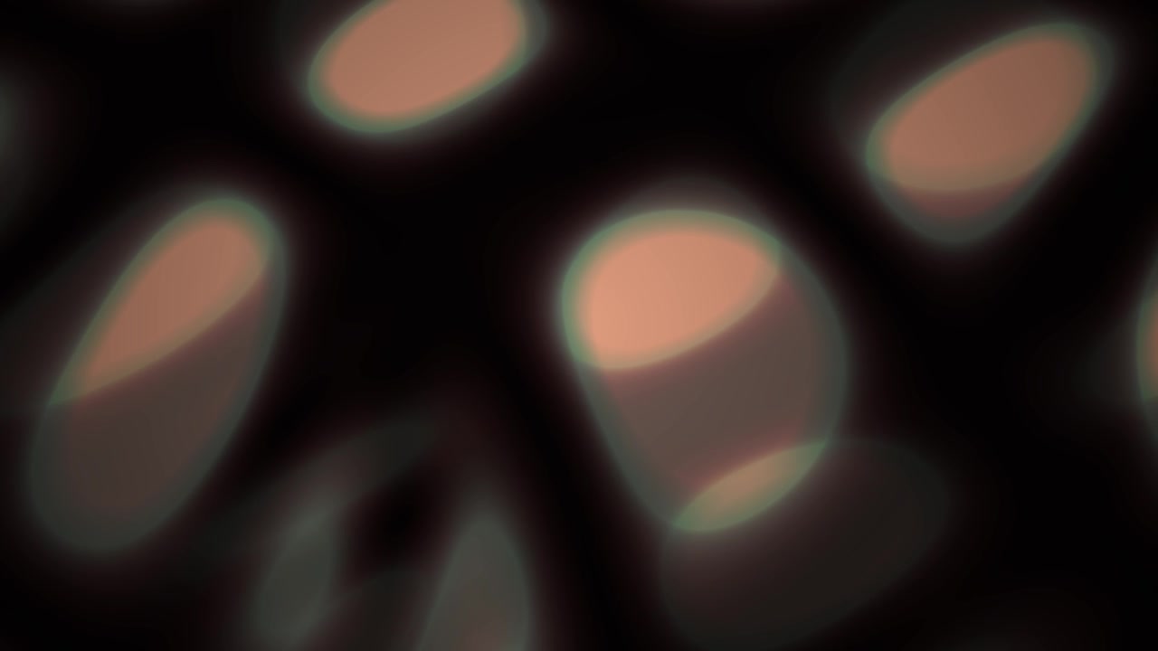 Soft Glowing Oval Bokeh Lights on Dark Abstract Background