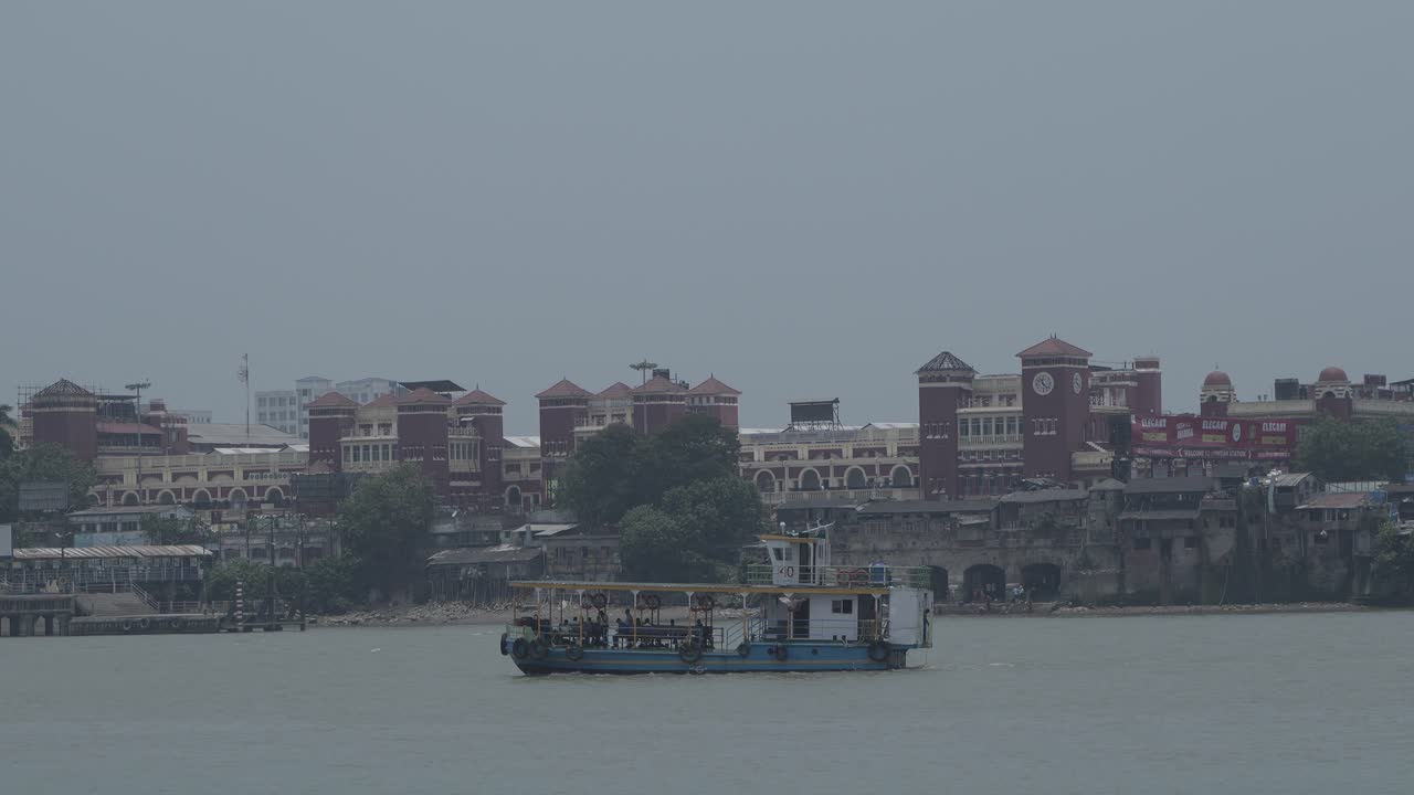 Ferry Boat on a River in Front of Historic City Buildings