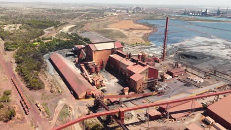 aerial drone shot port augusta whyalla steelworks iron ore buildings outback mining town travel industry tourism adelaide south australia 4k