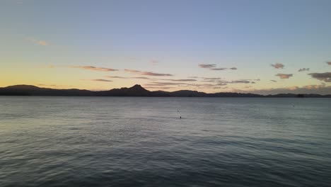 Cinematic-drone-flight-low-above-the-water-flying-through-the-Coromandel-Peninsula-of-New-Zealand