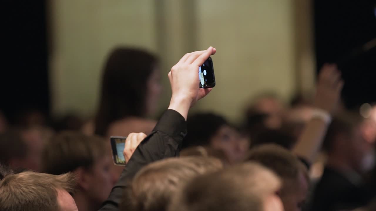 People taking pictures at an event
