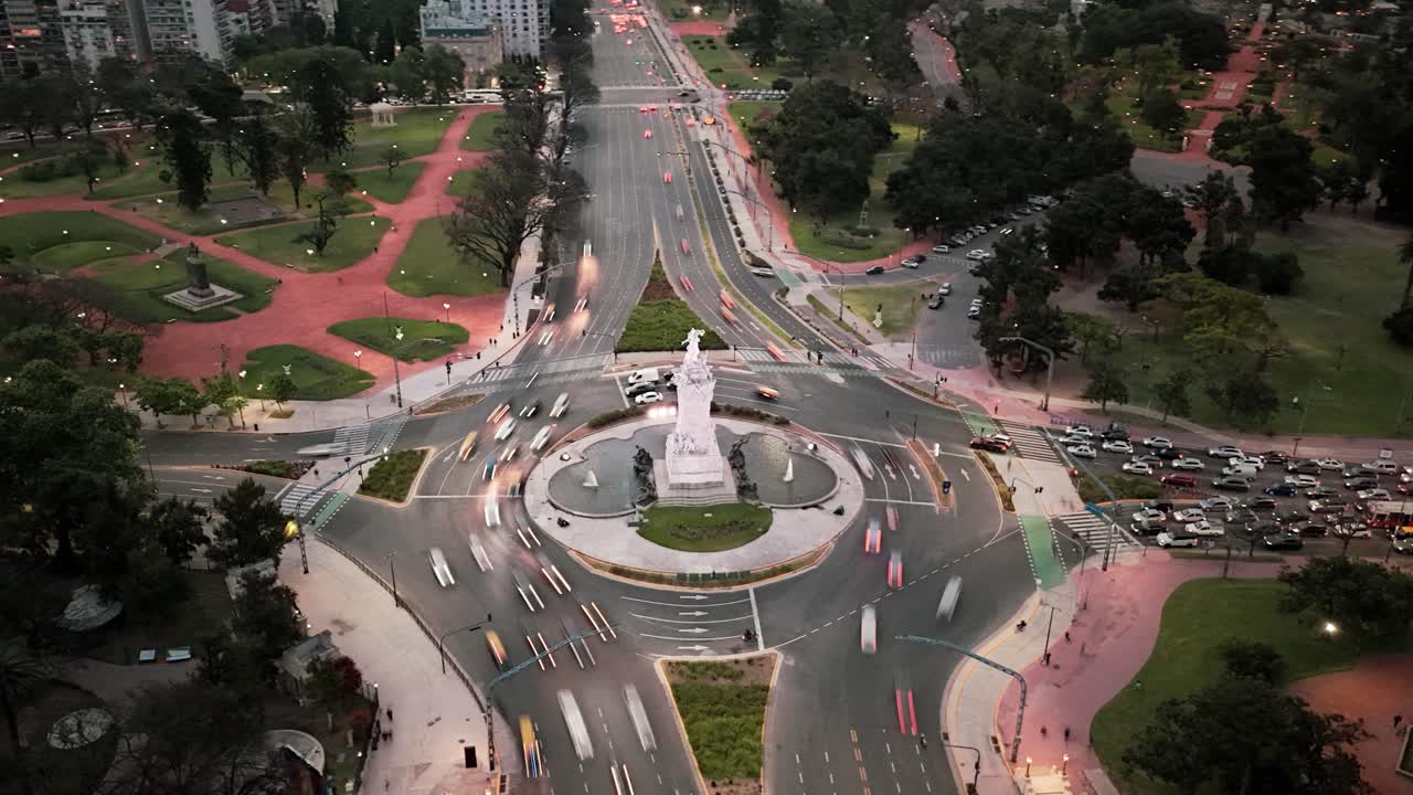 Aerial motionlapse of traffic by Españoles monument in Buenos Aires at dusk