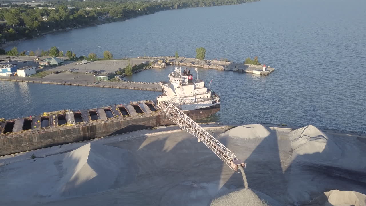 Sand Dredging Vessel At The Reclamation Area In Kingsville, Ontario, Canada On A Sunny Day - aerial drone shot