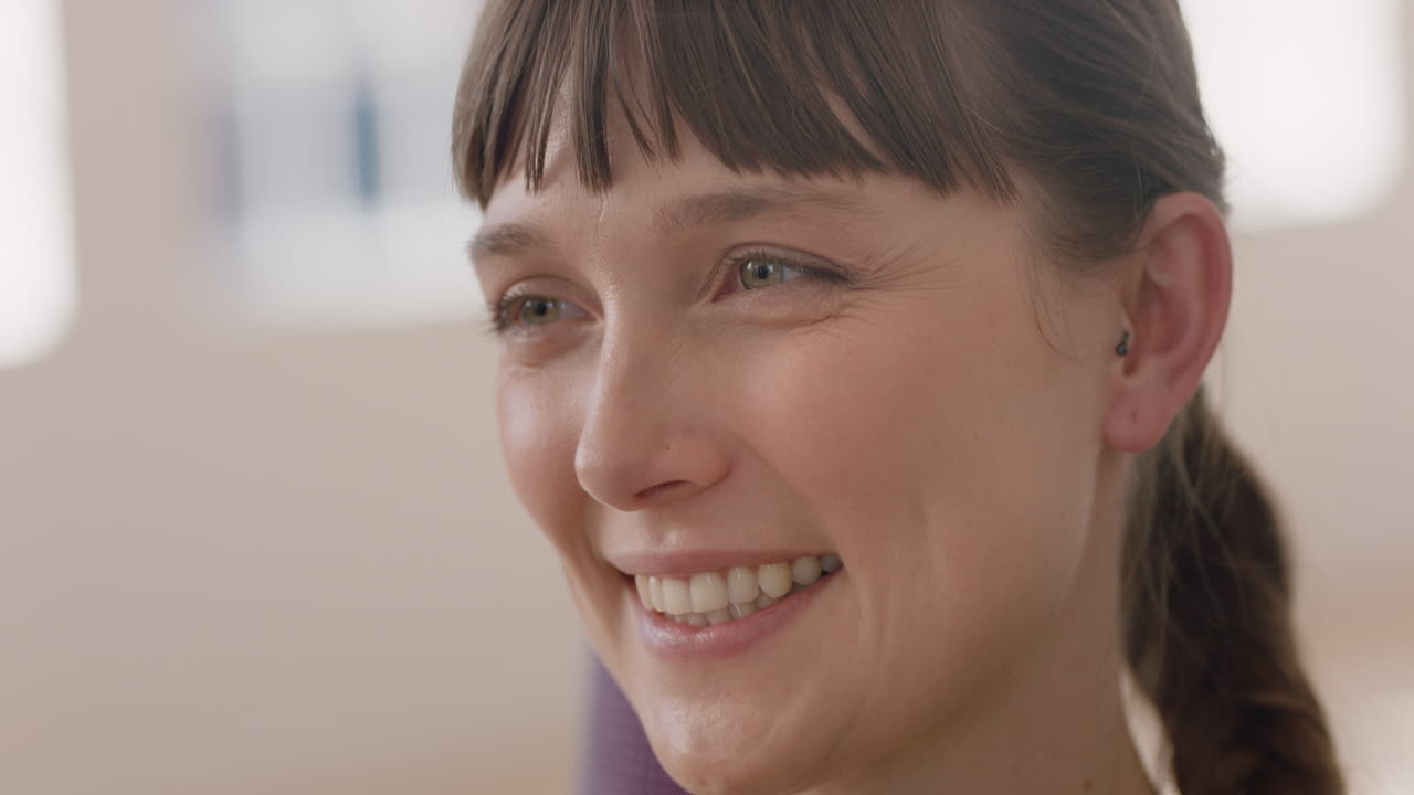 close up portrait beautiful caucasian woman smiling enjoying yoga class practicing healthy lifestyle in fitness studio