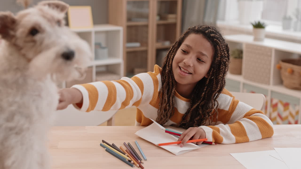 Girl Drawing and Talking to Dog