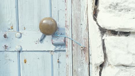 opening door of old irish stone cottage