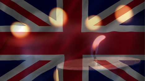 british flag with candle going out