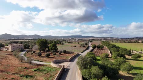 aerial ascending shot of countryside landscape with mountains on mallorca island, spain