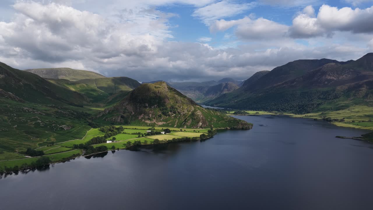 Stunning aerial view over Crummock water with Rannerdale Knotts, the Buttermere valley and sourounding Fells, The Lake District, Cumbria, England