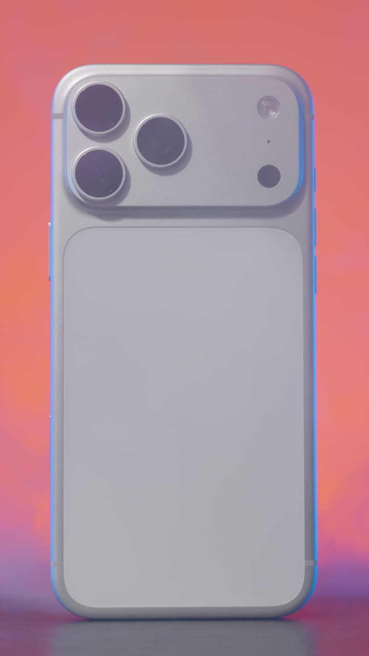 New modern smartphone appearing from a thick cloud of smoke with colorful lighting. Action