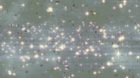 animation of glowing christmas lights rising over smoke and falling confetti