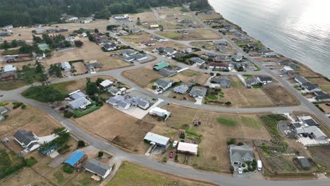 Aerial-view-of-a-rural-neighborhood-bordering-the-Pacific-Ocean